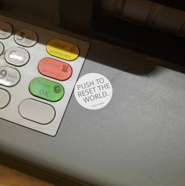 Push to reset the world, sticker art at an ATM (Athens, GR).