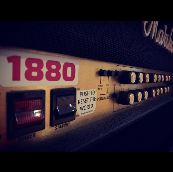 Push to reset the world, sticker art on a Marshall amplifier (Planet Earth).