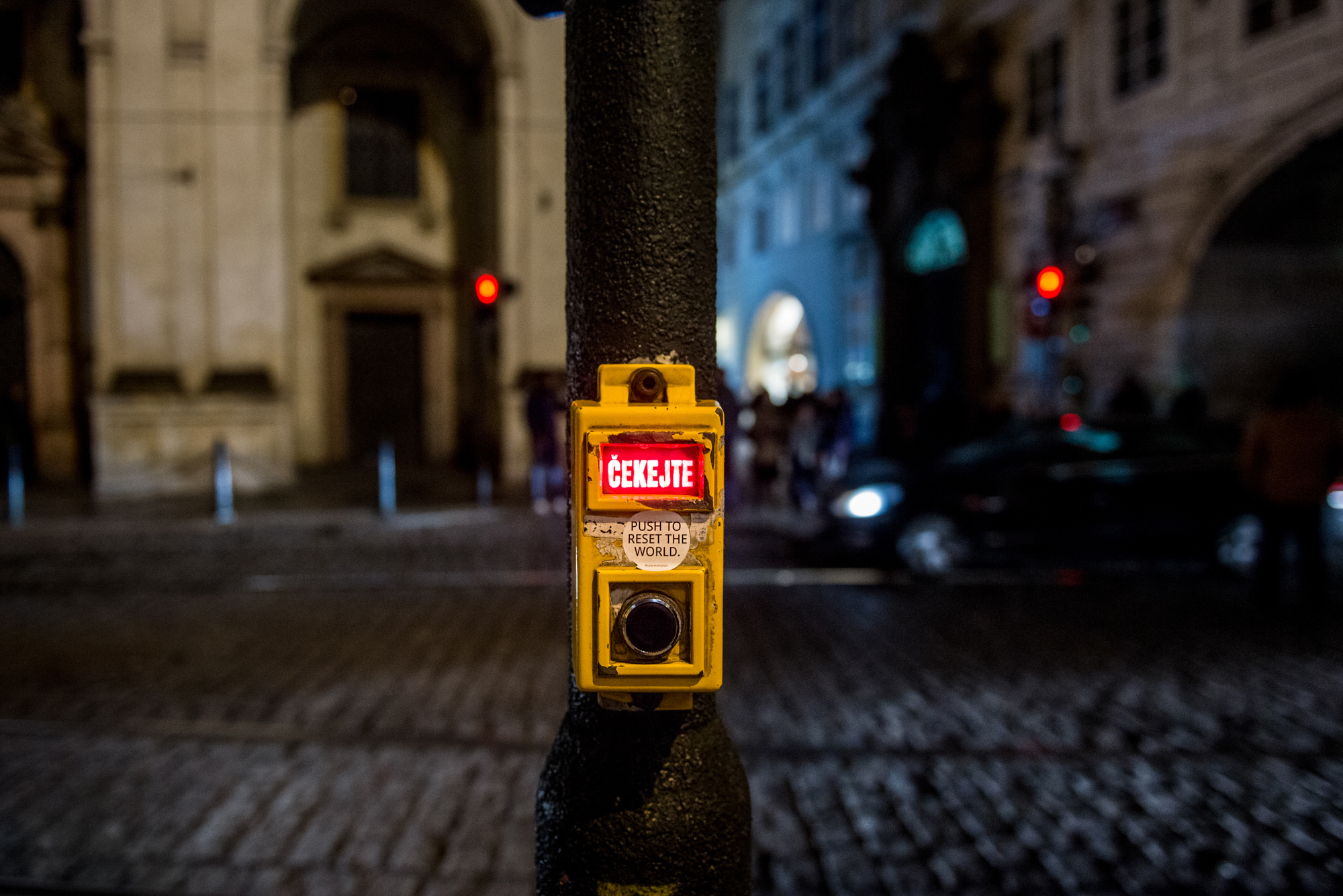Push to reset the world. Sticker in the streets of Prague, 2019 © by @Space_Utopian (Prague, Czech Republic).
