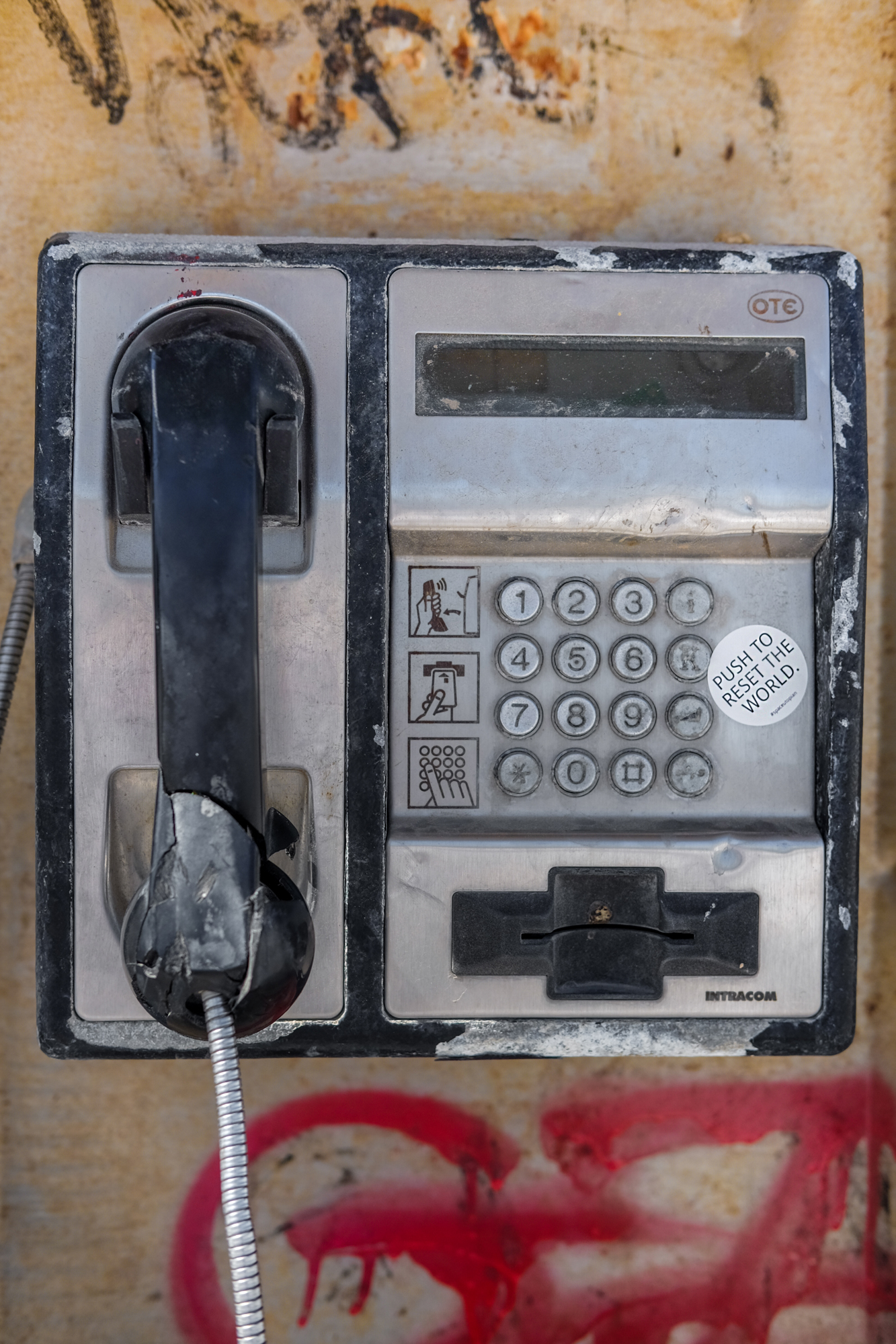 Push to reset the world. Sticker in the streets of Santorini, 2019 © by @Space_Utopian (Santorini, Greece).