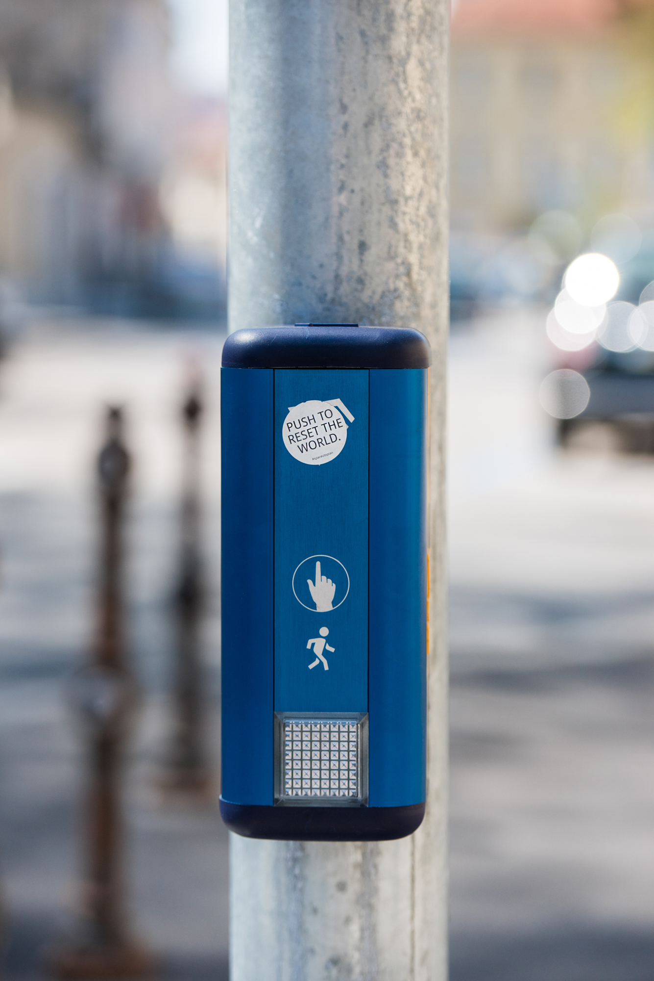Push to reset the world. Sticker in the streets of Ljubljana, 2019 © by @Space_Utopian (Ljubljana, Slovenia).